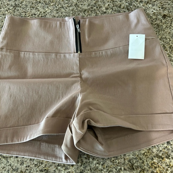 Mauve colored top and shorts.
Stretchy - Picture 8 of 12